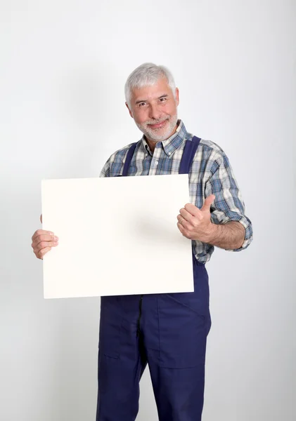 Portrait of artisan showing white board — Stock Photo, Image