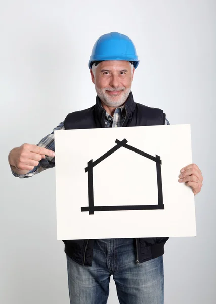 Property developer showing house for sale sign — Stock Photo, Image