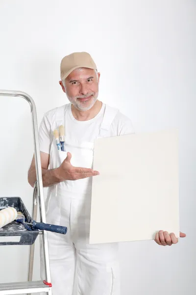 Professional painter showing message board — Stock Photo, Image