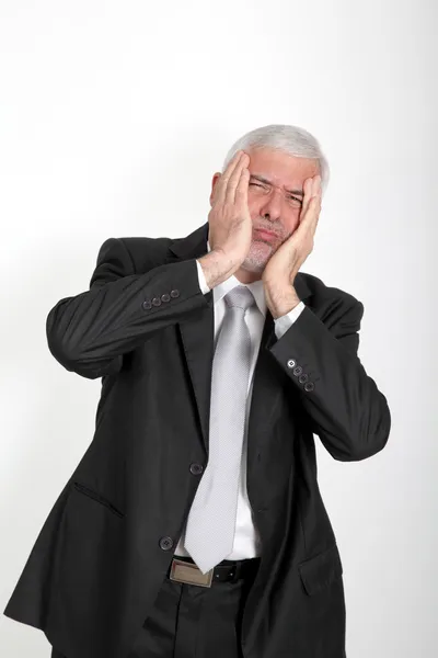 Businessman with annoyed look on his face — Stock Photo, Image