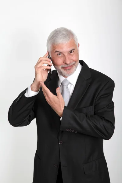 Üzletember beszél mobilon. — Stock Fotó