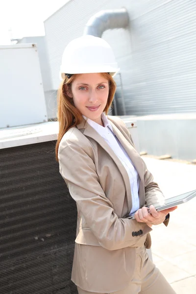 Portrait of businesswoman wearing security helmet — Stock Photo, Image