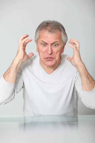 Senior man with mad expression — Stock Photo, Image