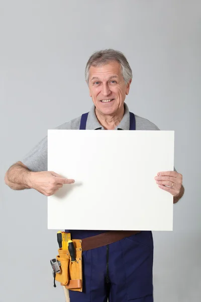 Portret van senior artisan op witte achtergrond — Stockfoto