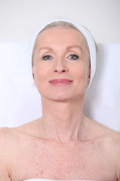 stock image Closeup of senior woman having a face massage