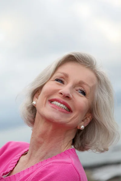 Portrait of laughing senior woman — Stock Photo, Image