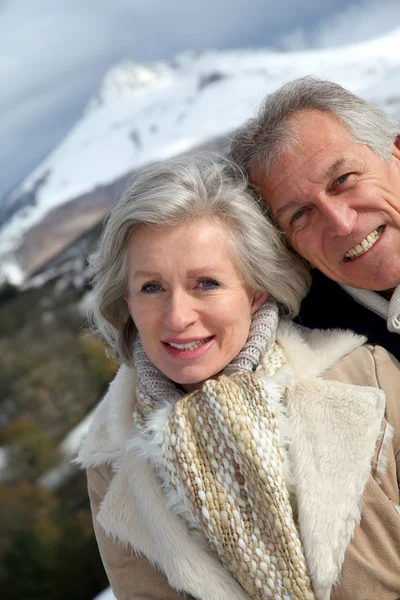 Portrait of happy senior couple at the mountain — Stock Photo, Image
