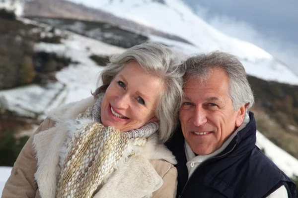 Portrait of happy senior couple at the mountain — Stock Photo, Image