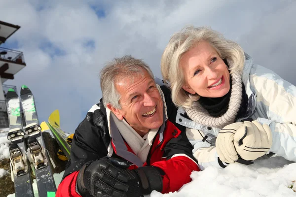 Senior couple having fun at ski resort — Stock Photo, Image