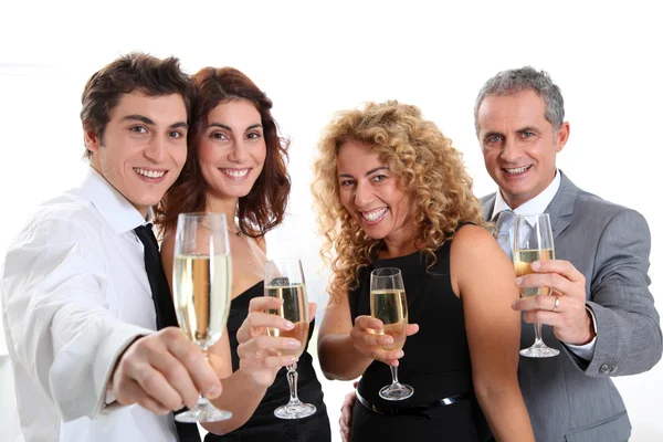 Group of friends cheering with glasses of champagne — Stock Photo, Image
