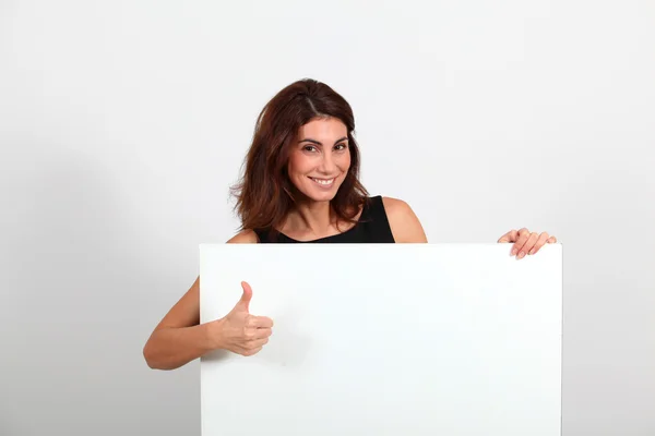 Portrait of businesswoman holding whiteboard — Stock Photo, Image