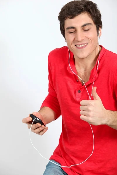 Man dancing with music player — Stock Photo, Image
