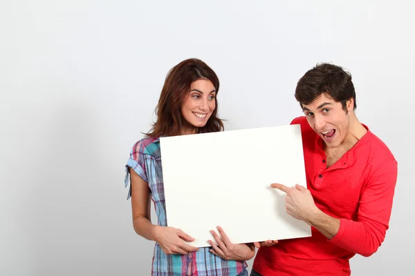 Couple holding whiteboard — Stok fotoğraf