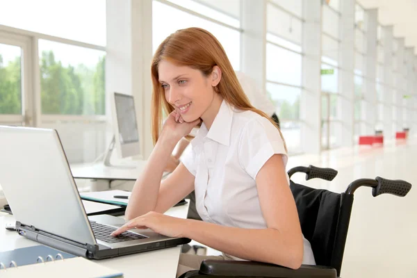 Handicapped woman in office Stock Image