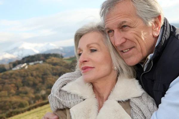 Portrait of happy senior couple in countryside Royalty Free Stock Images