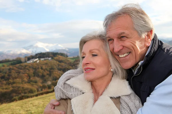 Portrait of happy senior couple in countryside Royalty Free Stock Images