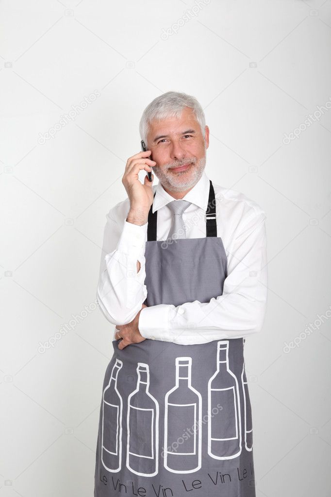 Wine waiter talking on the phone