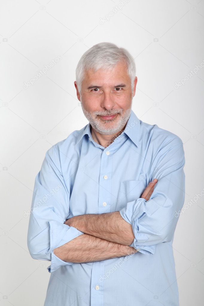 Smiling senior man with blue shirt