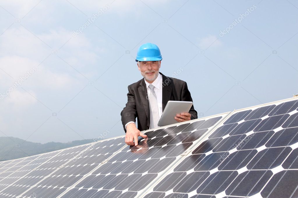 Businessman checking photovoltaic installation