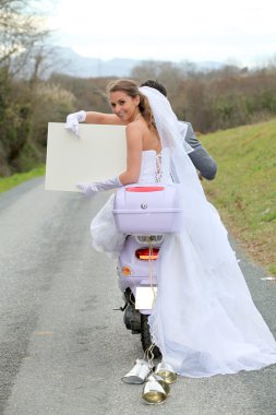 Married couple riding motorcycle