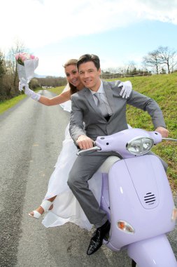 Married couple riding motorcycle