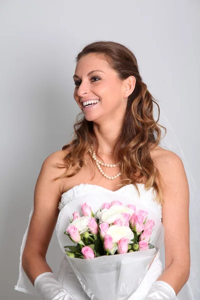 stock image Beautiful bride holding flowers bouquet