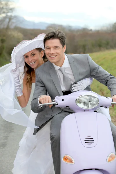 Married couple riding motorcycle — Stok fotoğraf