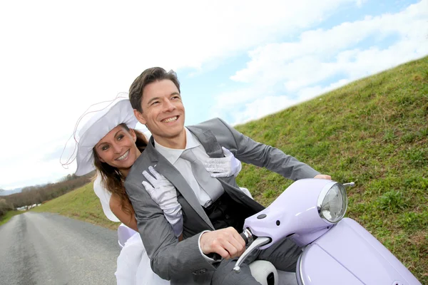 Married couple riding motorcycle — Stok fotoğraf
