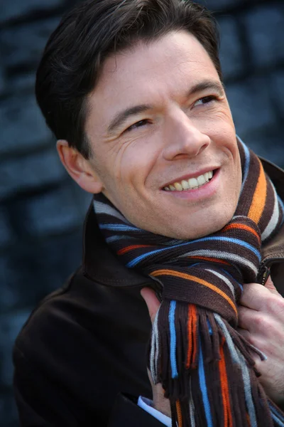 Portrait of handsome man wearing scarf — Stock Photo, Image