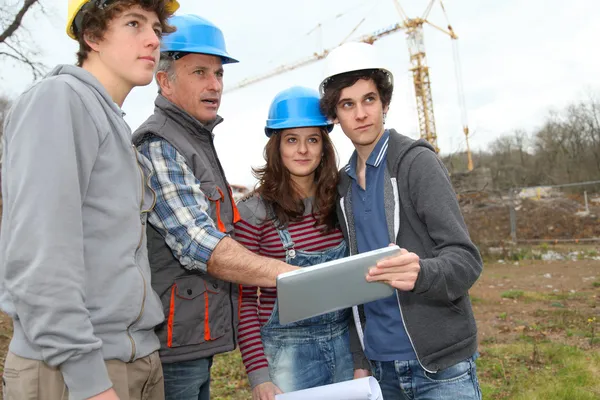Adult with group of teenagers in professional training — Stock Photo, Image