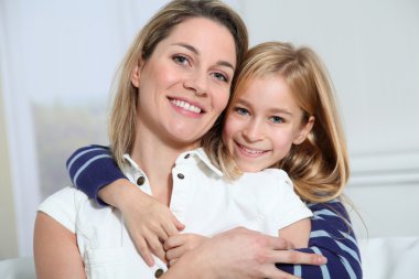 Portrait of happy mother and little girl clipart