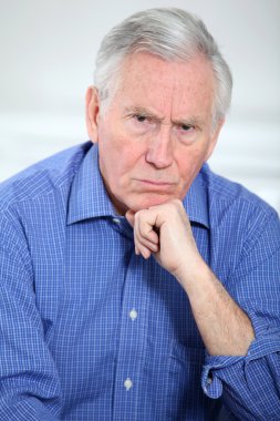 Portrait of upset elederly man clipart