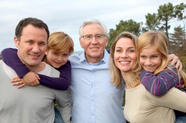 Family portrait standing outside clipart