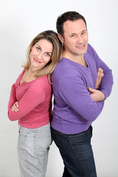Happy couple standing on white background — Stock Photo, Image