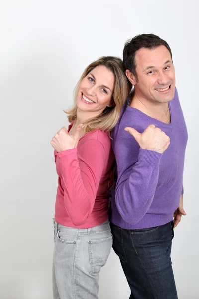 Happy couple standing on white background — Stock Photo, Image