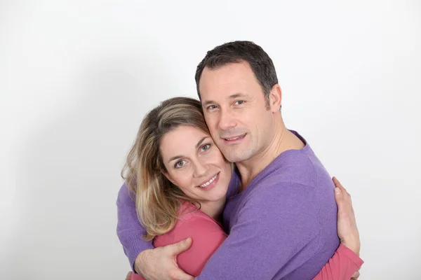 Portrait of in loved couple standing on white background — Stock Photo, Image