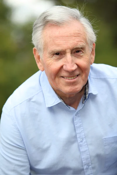 Portrait of smiling elderly man — Stock Photo, Image