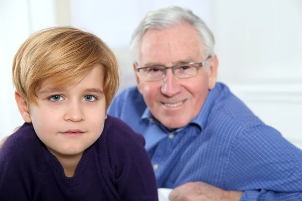 Portrait of little blond boy with grandfather — Stock Photo, Image