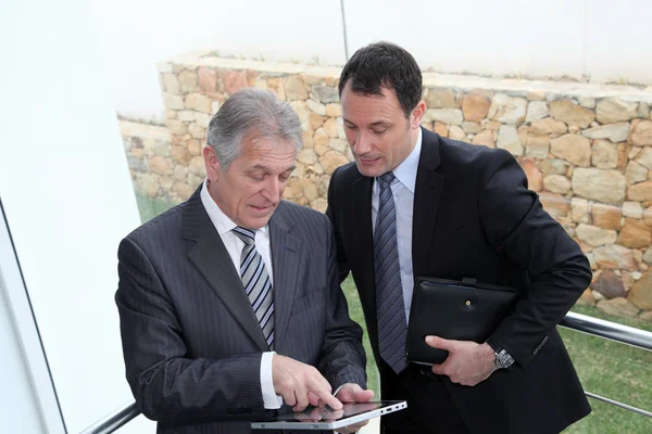 Sales working on electronic tablet — Stock Photo, Image
