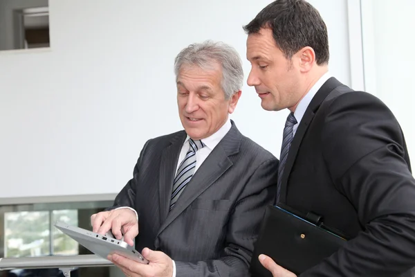 Sales working on electronic tablet — Stock Photo, Image