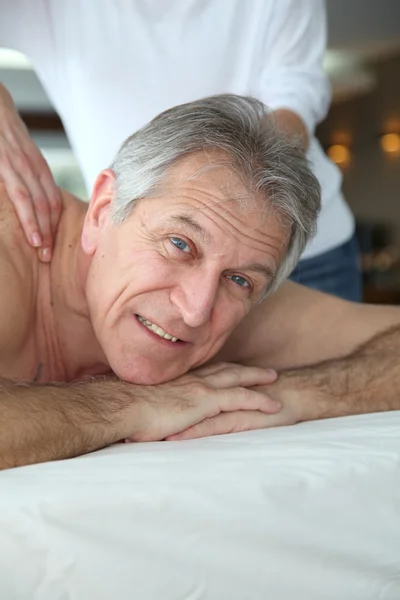 Senior man having a massage — Stock Photo, Image
