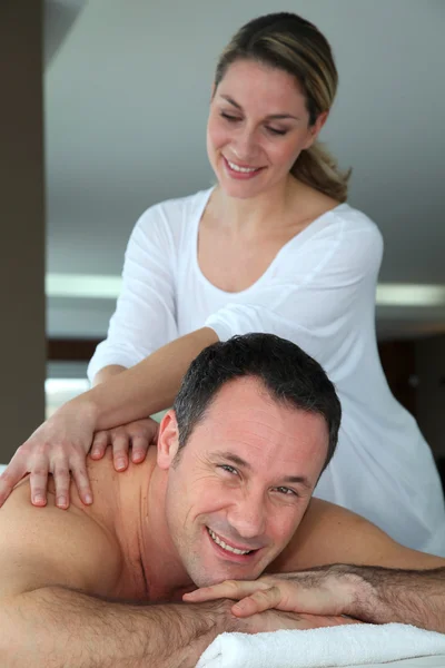 Handsome man having a massage — Stock Photo, Image