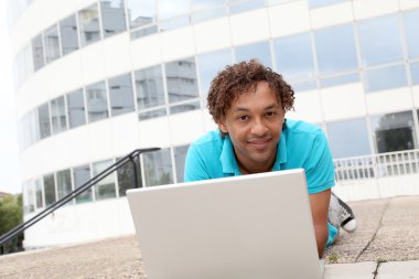 College student with laptop computer clipart