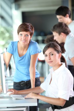 Young women working in the office clipart