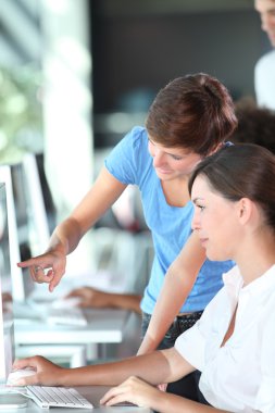 Young women working in the office clipart