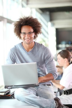 Young man working in the office clipart