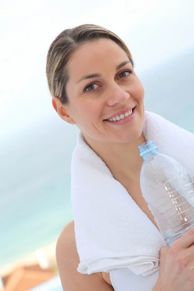 Woman drinking water from bottle — Stock Photo, Image