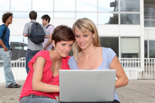 Students with laptop computer — Stock Photo, Image