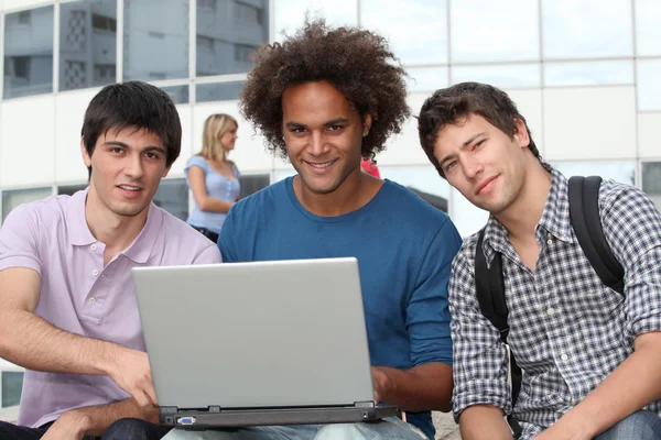 Students with laptop computer — Stock Photo, Image