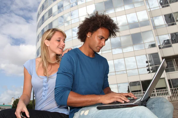 Students working on laptop computer — Stock Photo, Image